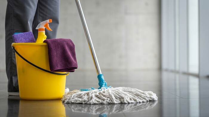 Cleaning bucket and mop on a commercial floor